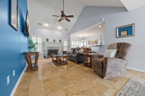 a living room with furniture and a ceiling fan at Relaxing 3BR Duplex Home w/ Pool & Patio in Buford