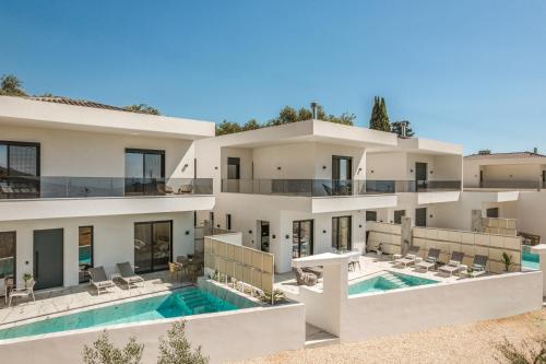 an aerial view of a house with a swimming pool at Zandore Villas Perdika private Luxury Villas Epirus Villas in Pérdika