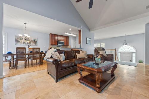 a living room with a couch and a table at Relaxing 3BR Duplex Home w/ Pool & Patio in Buford