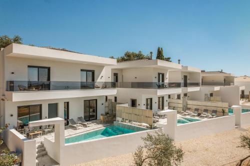 an aerial view of a villa with a swimming pool at Zandore Villas Perdika private Luxury Villas Epirus Villas in Pérdika
