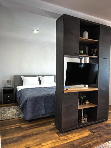 Postel nebo postele na pokoji v ubytování Pera Apartments