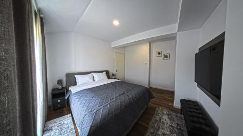 Postel nebo postele na pokoji v ubytování Pera Apartments