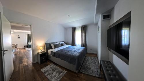 Postel nebo postele na pokoji v ubytování Pera Apartments
