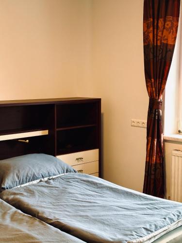 a bedroom with a bed and a window at Sunlit Apartment with Garden, Next to Station, Vienna in Vösendorf