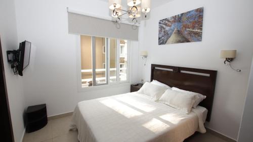 Katil atau katil-katil dalam bilik di Mahogany Suites by Skyreach Group
