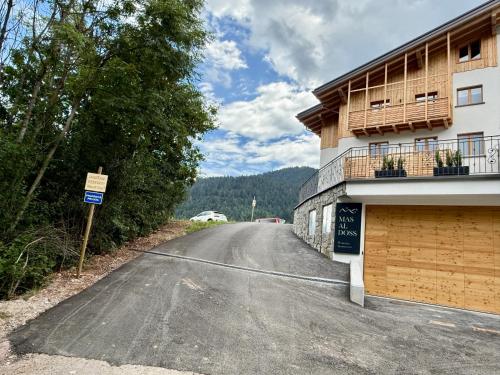 an empty road in front of a building at Appartamento Ciclamino in Andalo