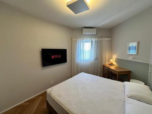 Postel nebo postele na pokoji v ubytování Summit Flat São José dos Campos
