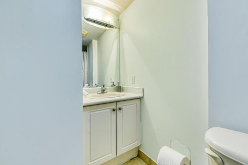 a bathroom with a sink and a mirror at RivetStays - The Pantages Suite in Toronto