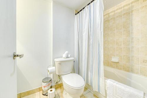 a bathroom with a toilet and a shower at RivetStays - The Pantages Suite in Toronto
