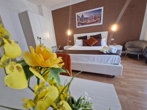 a hotel room with a bed and a couch at Politeama Center in Palermo