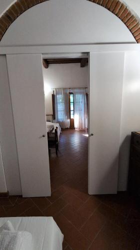 a room with an open door to a bedroom at Agriturismo Amici Miei in Marliano