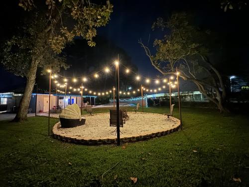 a park lit up at night with lights at Emperors Pool House in Jacksonville