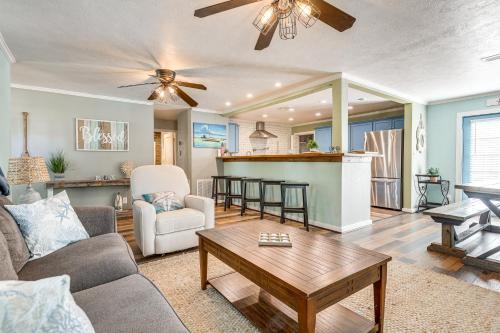 a living room with a couch and a table at Families, Groups, Pets! Galveston Gem 2 Mi to Sand in Galveston