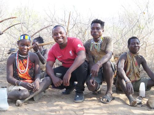 a group of men posing for a picture at Msovi House in Arusha