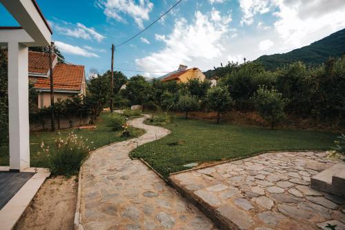 a stone path in a yard with a house at Dolce Luxury Villa in Nižepole