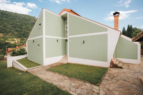 a house with white walls and a roof at Dolce Luxury Villa in Nižepole