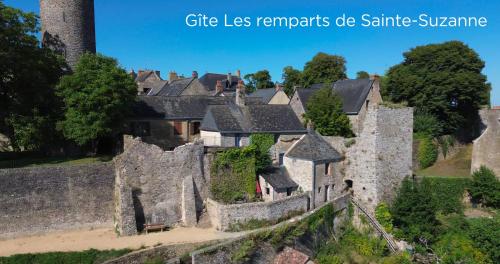 an aerial view of a castle with turrets at Les Remparts de Sainte-Suzanne in Sainte-Suzanne