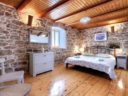 Ένα ή περισσότερα κρεβάτια σε δωμάτιο στο Holiday home DONADA