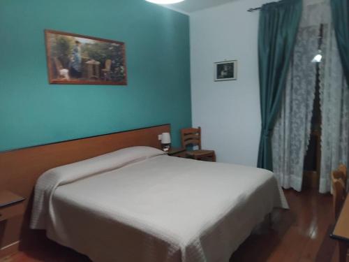 Postel nebo postele na pokoji v ubytování Hotel Turano