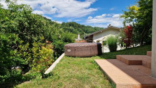 a garden with a large object in the grass at Bergmannhaus in Zagorje ob Savi