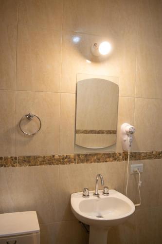 a bathroom with a sink and a mirror at Hotel del Monumento in Salta