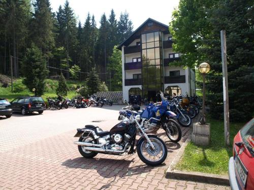 a group of motorcycles parked in front of a building at Garden Depandance Am Bach in Kurort Altenberg