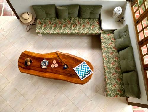 a living room with a couch and a wooden coffee table at CasaBella Cabaña con Piscina Palomino in Palomino