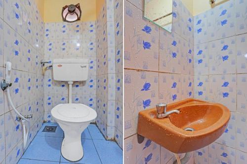 a bathroom with a toilet and a sink at SPOT ON The New View Regency in Trivandrum