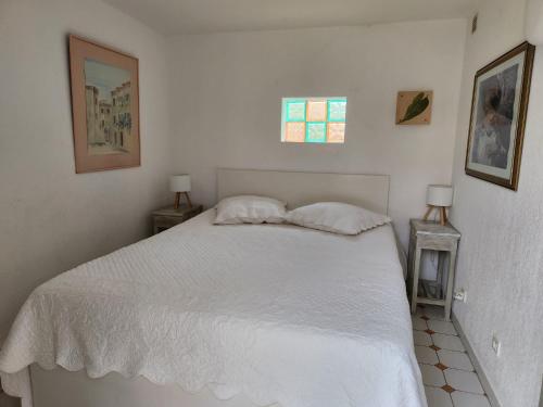 Un pat sau paturi într-o cameră la Le Hameau de la Nicolinière
