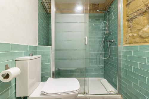 a bathroom with a toilet and a glass shower at Exclusive Boutique in Jerez de la Frontera