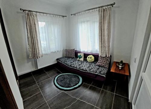 a living room with a couch and a table at Carla House in Vidolm