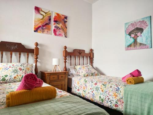 Ένα ή περισσότερα κρεβάτια σε δωμάτιο στο VolKKanrentals Villa Los Cactus