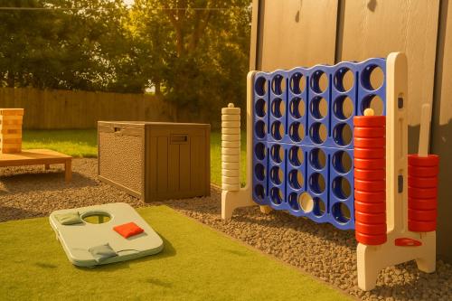 a playground with a large set of blue and red dominoes at Fun-Filled Backyard Firepit Grill Games Good Vibes in Houston