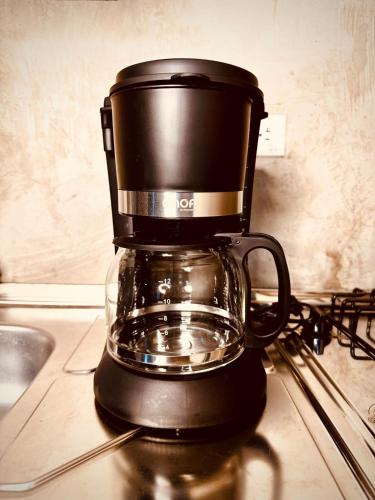 a coffee maker sitting on top of a counter at Beautiful loft with elevator for nomad envigado in Envigado