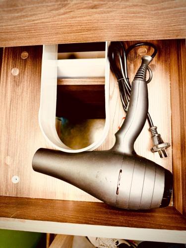 a bottle of wine in a wooden cabinet at Beautiful loft with elevator for nomad envigado in Envigado