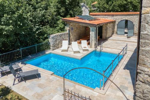 Bazén v ubytování Stone Villa Galant with Pool - Happy Rentals nebo v jeho okolí