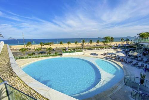 a view of a swimming pool and the beach at Hotel Nacional Rio de Janeiro in Rio de Janeiro