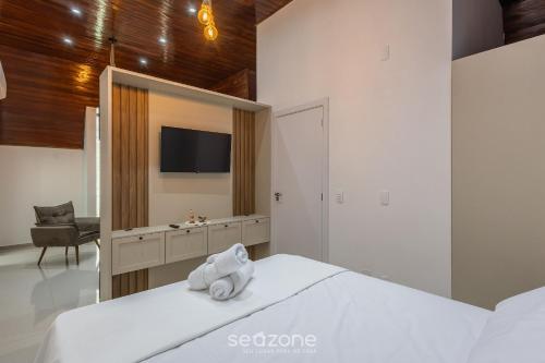 Ένα ή περισσότερα κρεβάτια σε δωμάτιο στο Studio Aconchegante em Itapema, SC RGOB701
