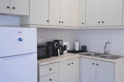 Kuchyň nebo kuchyňský kout v ubytování Apartment Simply 104