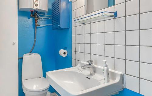 a bathroom with a sink and a toilet at Lovely Home In Egå With Wifi in Egå