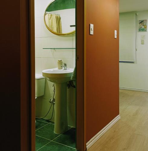 a bathroom with a sink and a mirror at Espacio Nodo II in Montevideo
