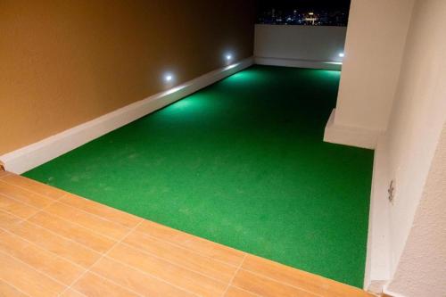 an empty room with green flooring in a building at Spacious 3BR Luxury Apartment Trizen Colombo 2 Near City Centre in Colombo