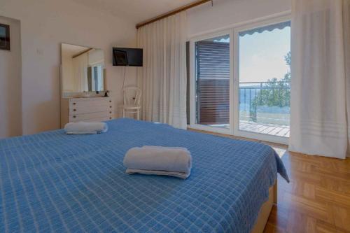 Postel nebo postele na pokoji v ubytování Apartment in Crikvenica 39237