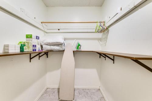 an empty room with a desk and a shelf at 2 Mi to Rainbow Beach Park South Side Charmer! in Chicago