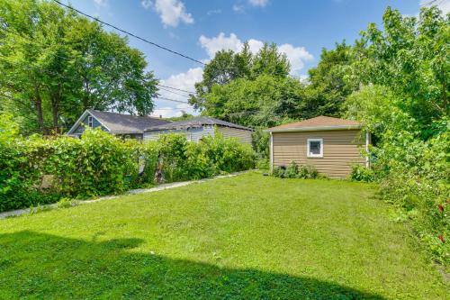 a yard with a small house and a yard at 2 Mi to Rainbow Beach Park South Side Charmer! in Chicago
