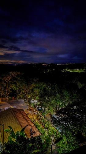 a view of a city with trees and a roof at Hotel Finca Recreacional La Fortaleza 