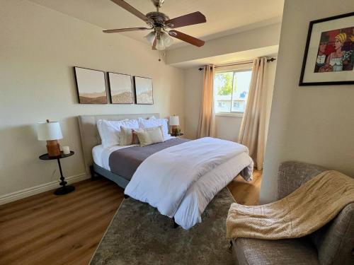 a bedroom with a bed and a ceiling fan at Osborn Oasis | Short Walk to Old Town Scottsdale in Scottsdale