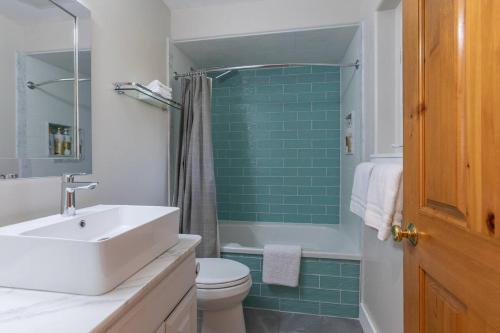 a bathroom with a sink and a toilet and a shower at Aspen Serenity - Hiking - in the Teton Valley in Driggs