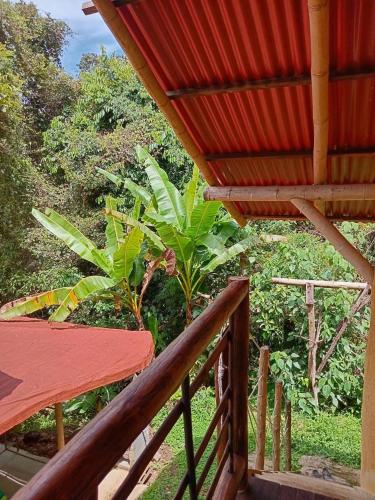 a balcony of a house with a red roof at Refugio Cumaná Entero in San Rafael