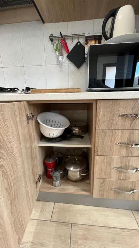 a kitchen with a cupboard with a microwave at Casamare in Roseto degli Abruzzi